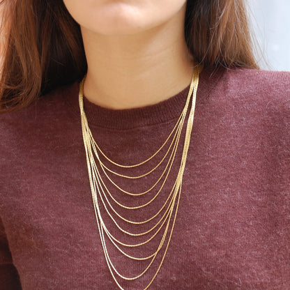 Collar Melena dorado, multicapa de cadenas finas · Blankspot COMO SI NADA